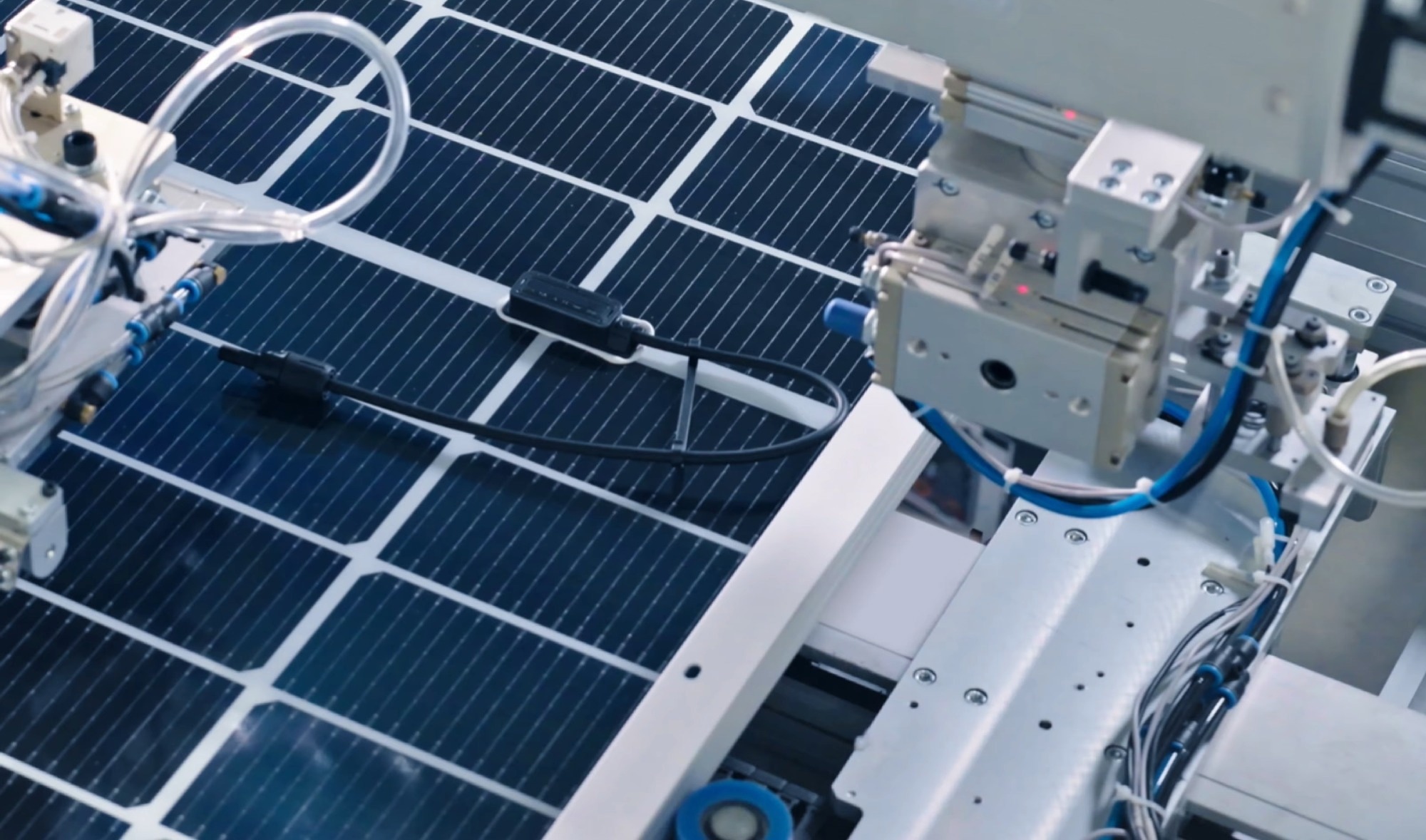 Image of a photovoltaic (PV) solar panel manufacturing process in an industrial facility using automation technology