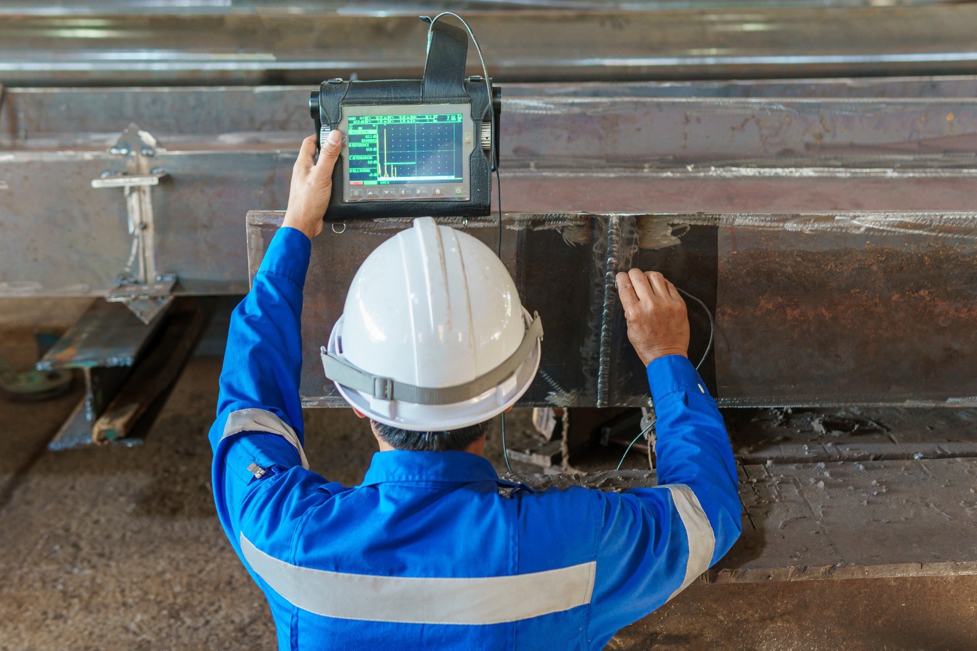 Inspectors are Inspection defects in Welded Steel H-beam add joints.