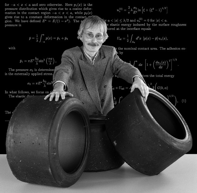 Nanoscopic Study of Rubber Friction on Road Surfaces