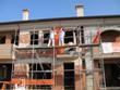 Innovative Plastic Composite Material to Stabilize Building Walls during Earth Quakes