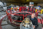 Helmholz Coils Unexpectedly Slow Growth of Magneto-Rayleigh-Taylor Instabilities