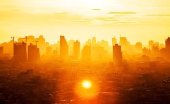Heating and Cooling Cities with Broadband Passive Daytime Radiative Cooling Materials