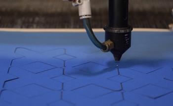 Patterned Cuts in Textiles to Develop Auxetic Materials with Tailored Properties