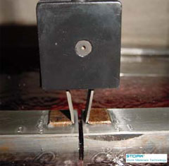 Use of a clip gage allows crack opening width to be measured.