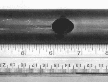 Unalloyed titanium tube perforated by pitting in hot brine