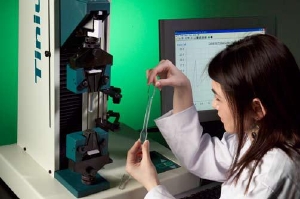Plastic tensile specimen about to be tested in single column tensile